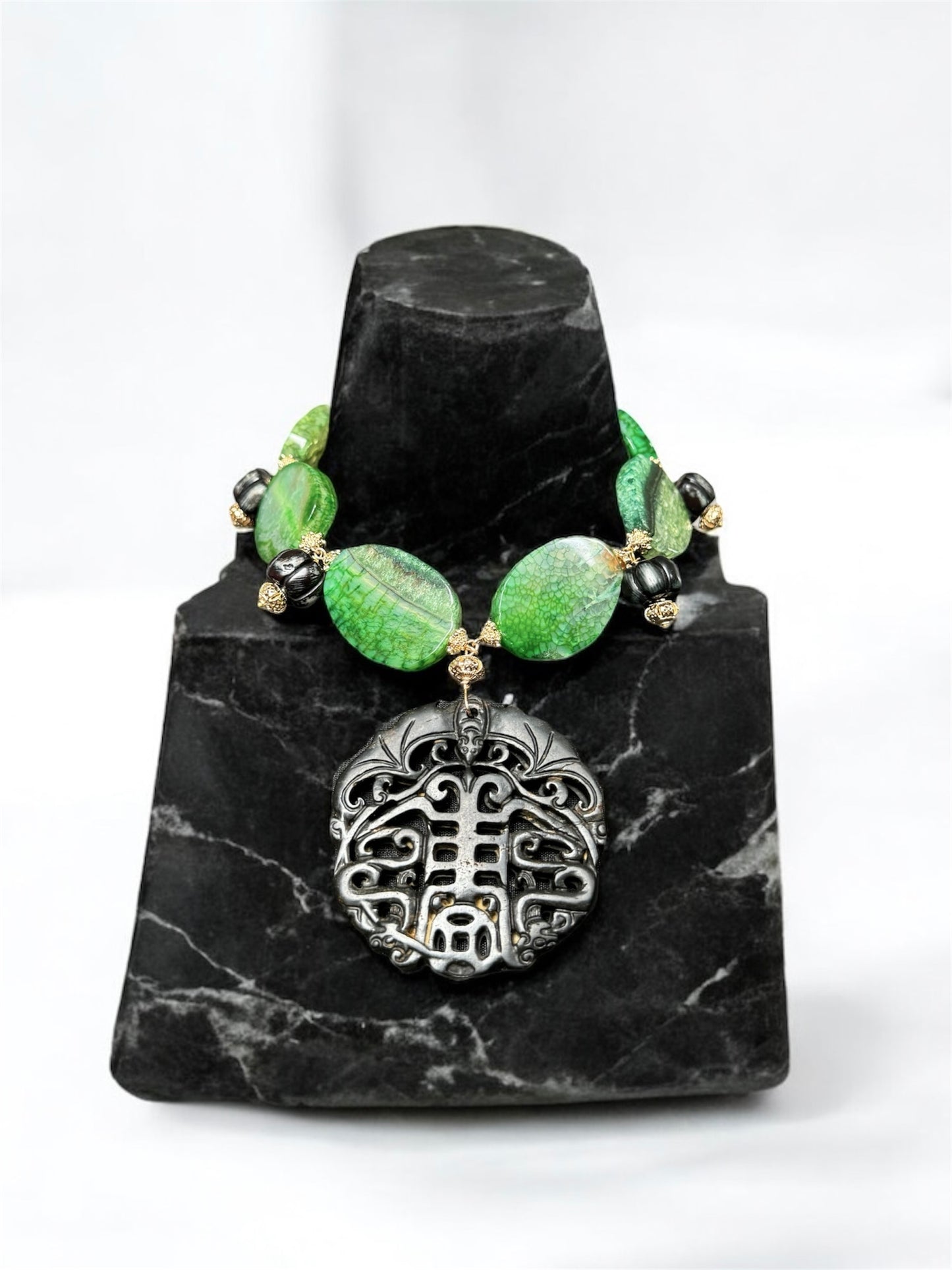 Handcrafted green gemstone artisan agate statement necklace with a carved black jade pendant
