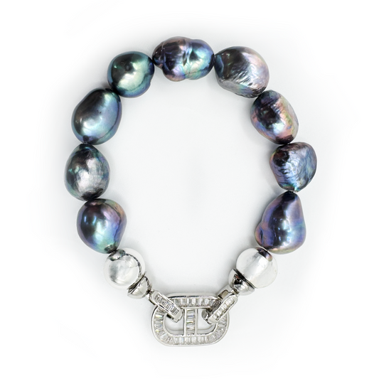 Pearl bracelet with a silver clasp on a white background